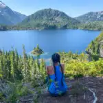 A woman enjoys the view above Bedwell Lake in Strathcona Provincial Park - one of the best places to go backpacking in BC without reservations