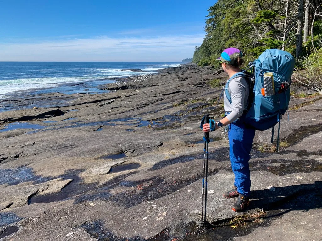A backpacker on the Juan de Fuca Trail on Vancouver Island - this is one of the best places to go backpacking in BC without reservations.