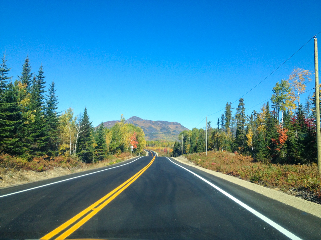 Driving through fall colours near Baie-Saint-Paul Quebec