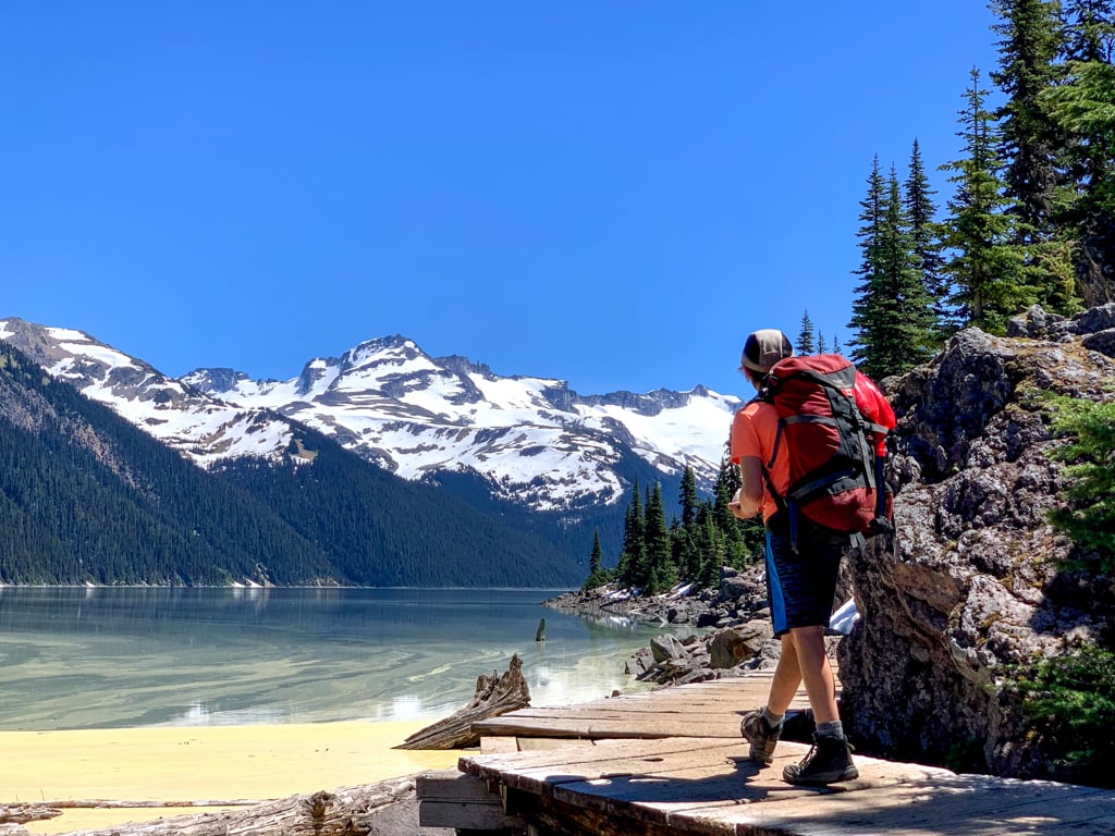 A tween hikes with a backpack at Garibaldi Lake