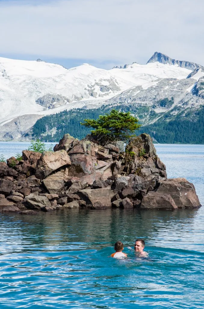 A father and son swimming in Garibaldi Lake