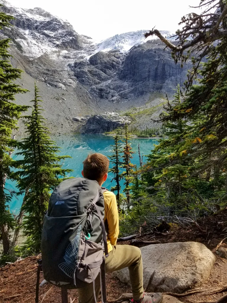 A boy backpacking at Joffre Lakes