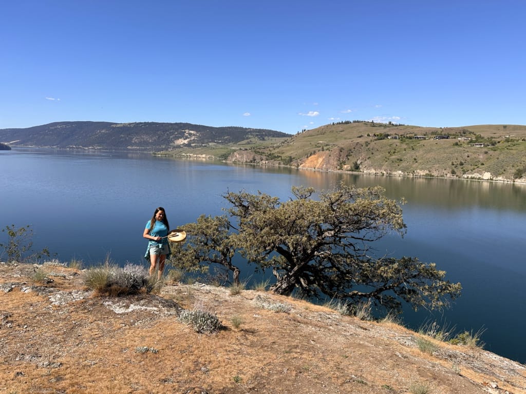 Laura from Ancestral Heartbeat Tours plays a drum and sings in Kalamalka Provincial Park in Vernon