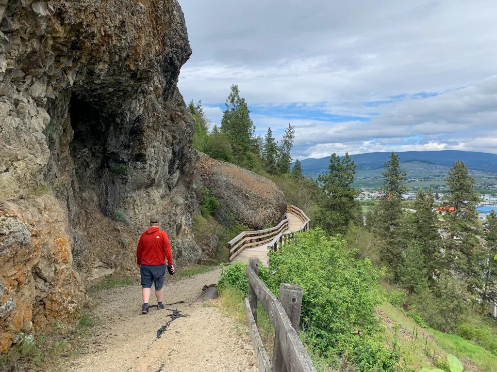 A hiker walks along the Grey Canal Trail in Vernon