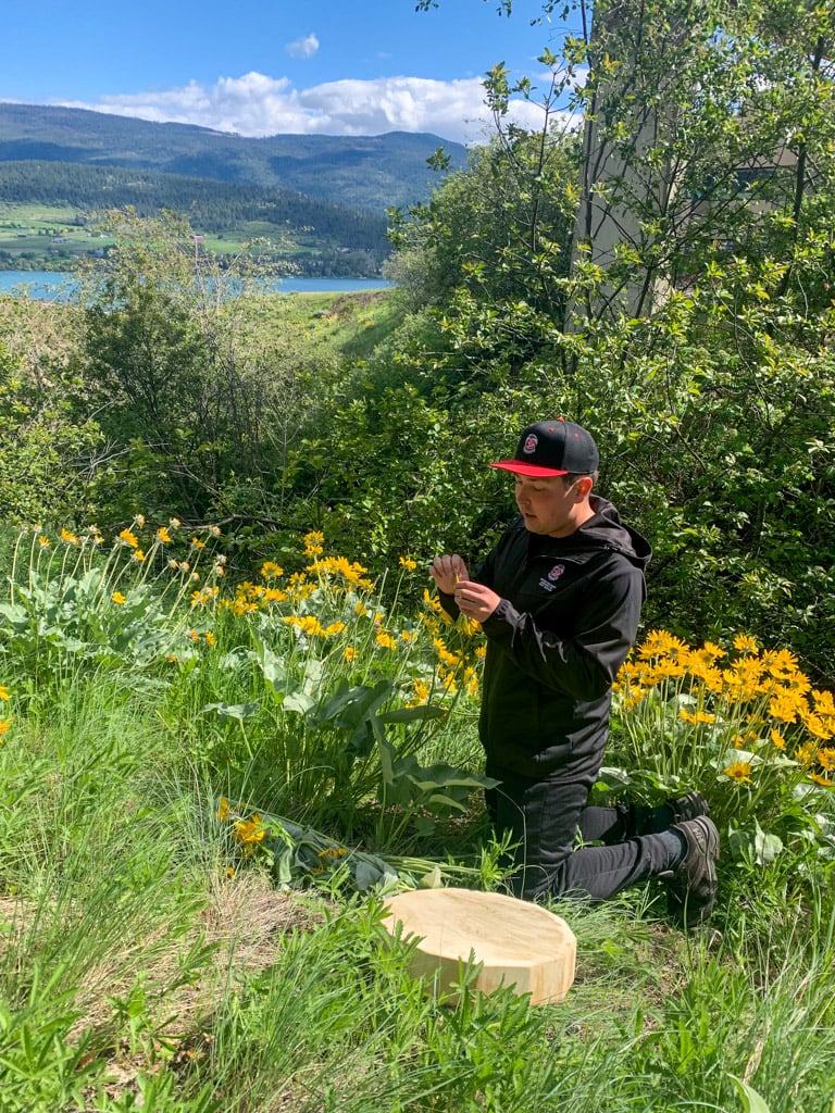 Justen Peters, a Syilx guide, leads a tour at the Kalamalka Indigenous Gardens in Vernon, BC