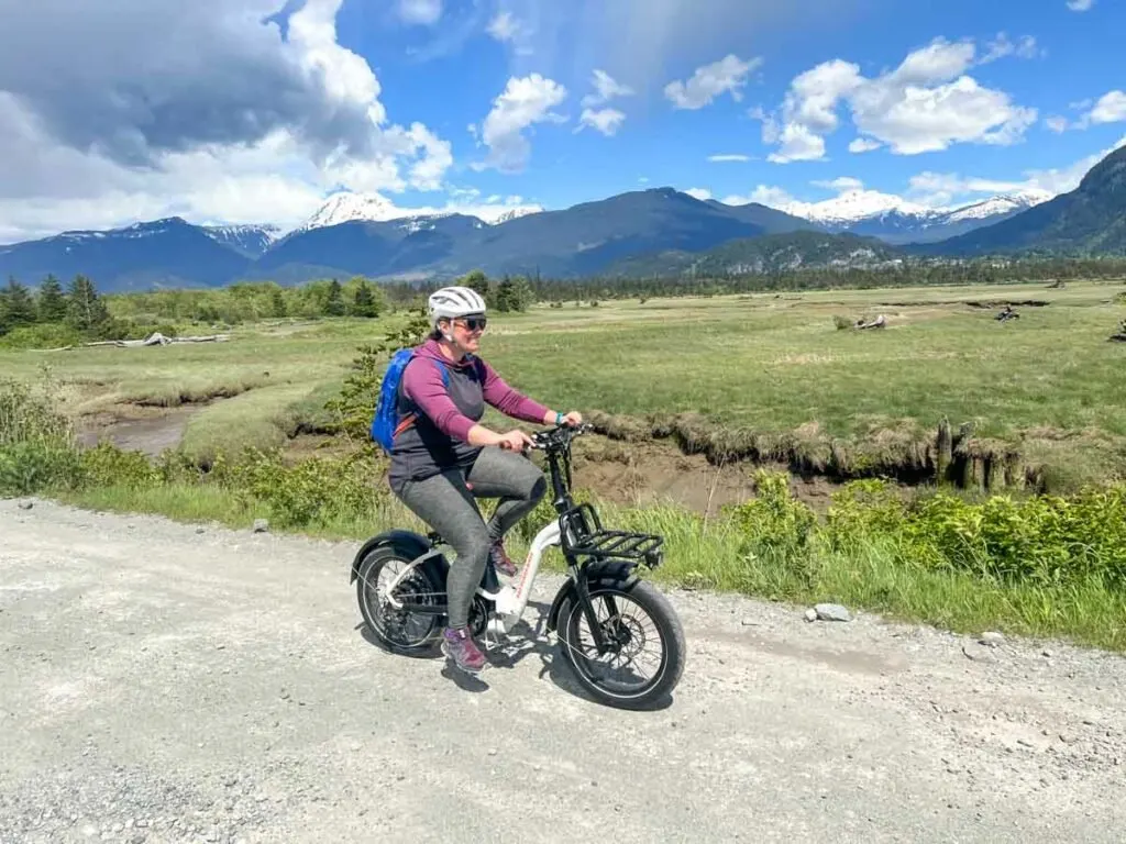 A woman rides a Rad Power Rad Mini Step-Thur electric bike in Squamish BC