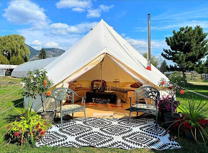 Luxurious glamping tent with carpet in front at Utopia Feels Botanical near Vernon, BC