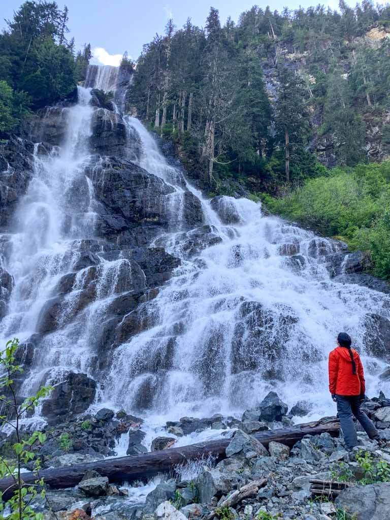 A hiker at the base of Della Falls on Vancouver Island