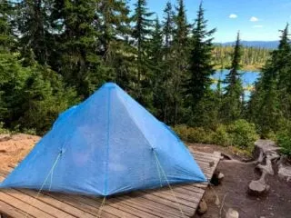 An ultralight tent at Kwai Lake in Strathcona Provincial Park - learn how to make your backpacking pack ultralight