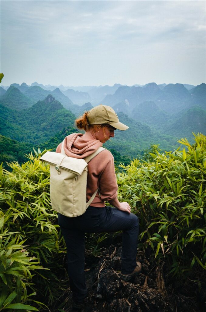 A woman wearing Mammut Runbold Zip-Off pants on a mountainside in Vietnam