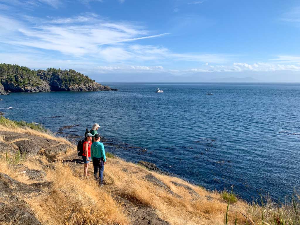 Hikers on the Coastal Trail in East Sooke Regional Park - a great place to stop on the Pacific Marine Circle Route