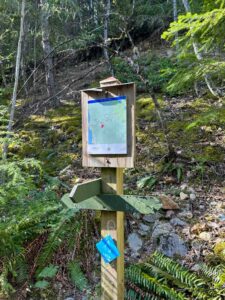 Info sign and map at the junction with the old trail to Tunnel Bluffs from Highway 99