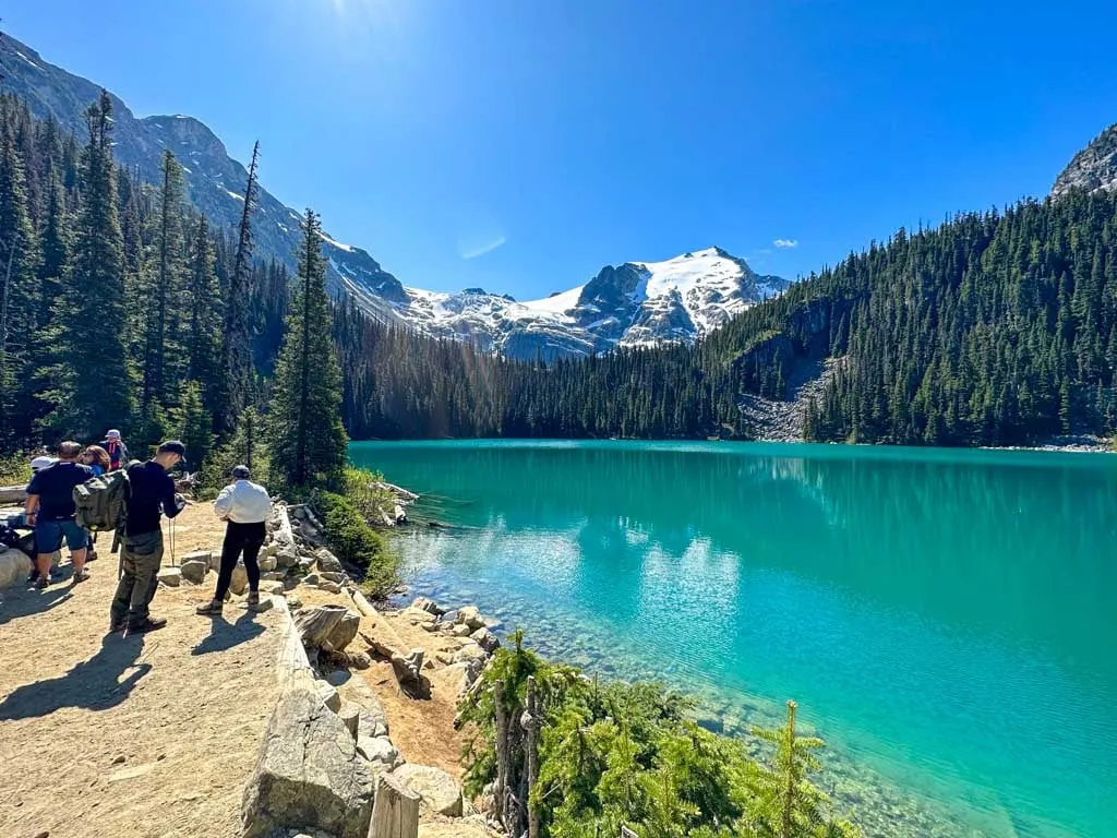 Hikers take a break at the Middle Joffre Lake Viewpoint.