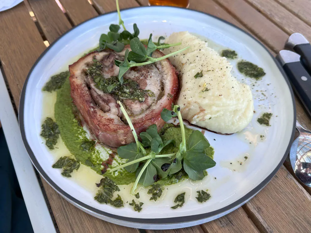 A plate of pork loin and potatoes from Blacktail Restaurant in Daajing Giids, BC