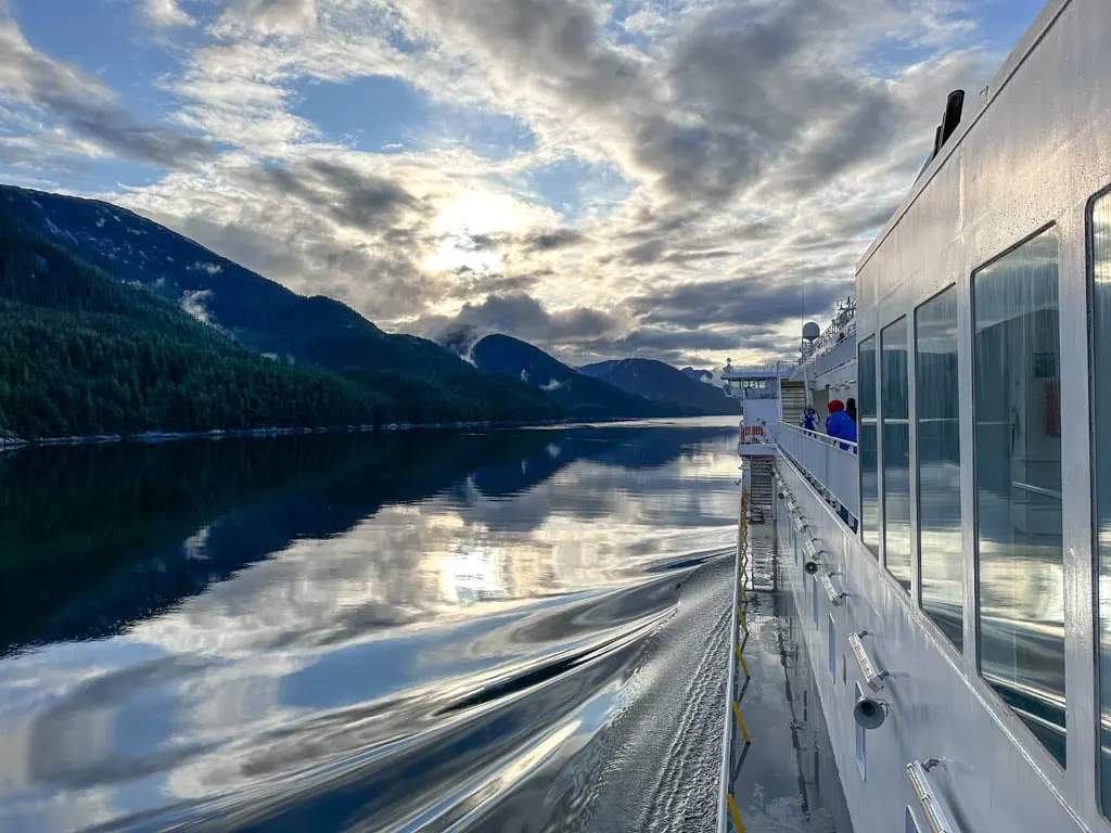 The Inside Passage ferry cuts through glassy calm waters