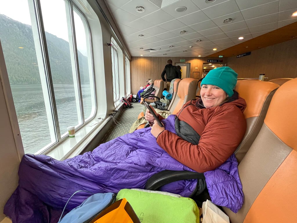 A woman gets ready to take a nap on the Inside Passage Ferry