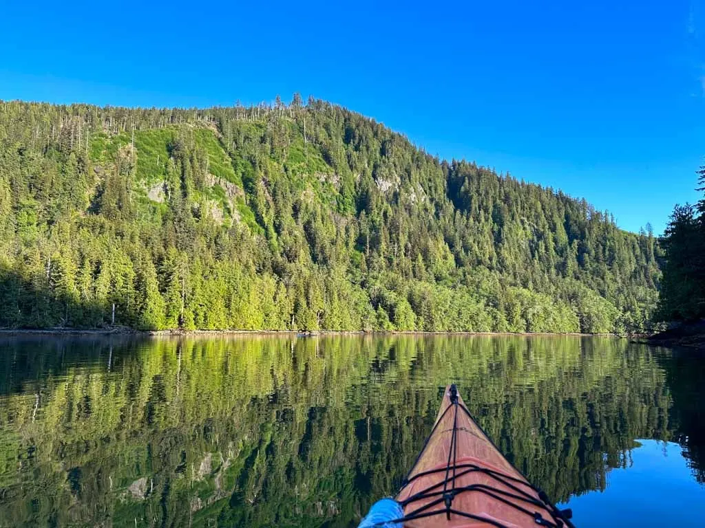 Kayaking in calm water in Gwaii Hanaas National Park