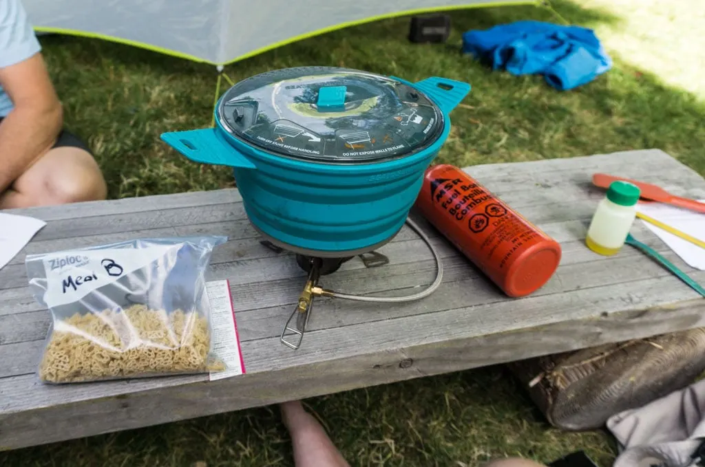 Repackage grocery store meals into Ziplocs for backpacking