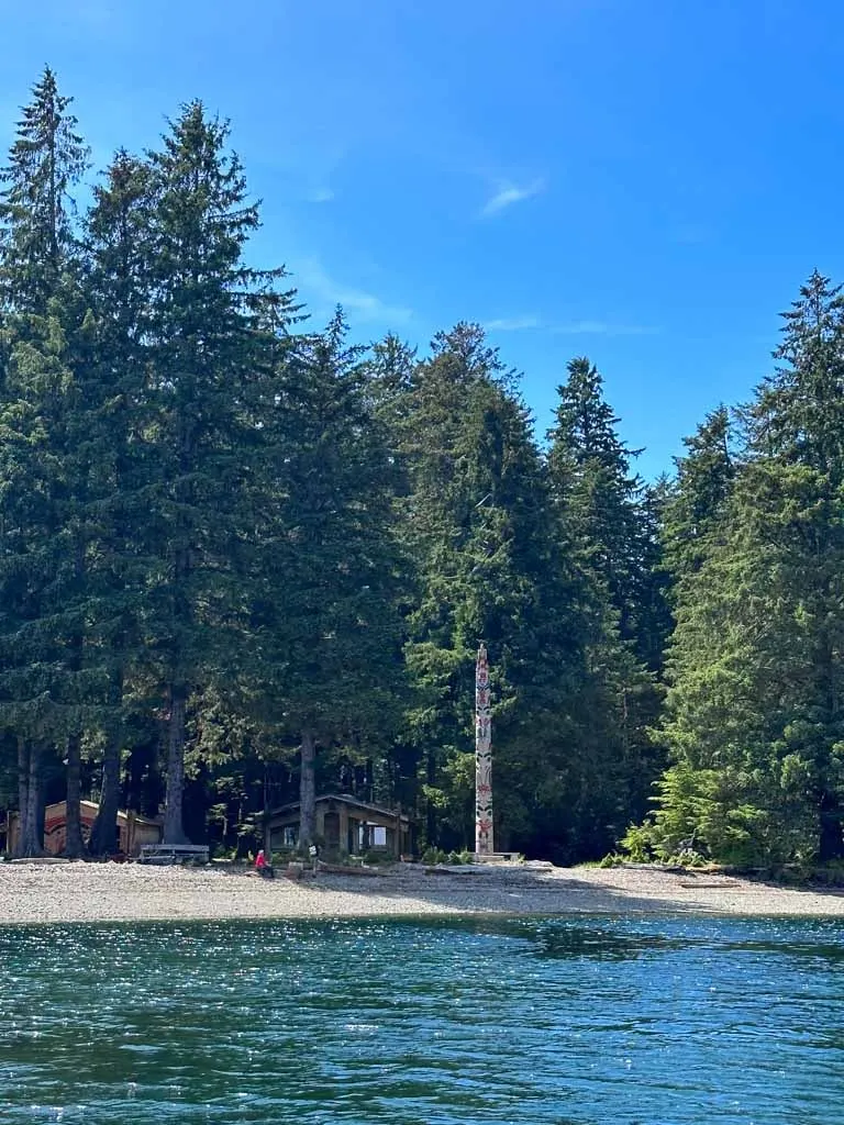 The memorial pole and watchmen cabin at Windy Bay in Gwaii Hanaas National Park