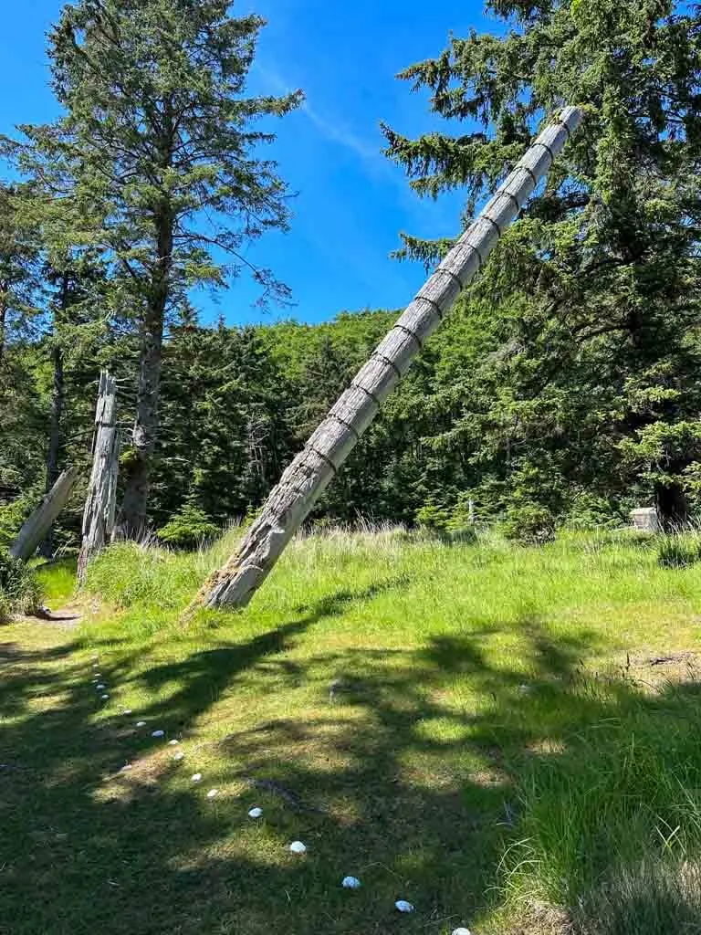 A leaning potlatch pole at K'unna