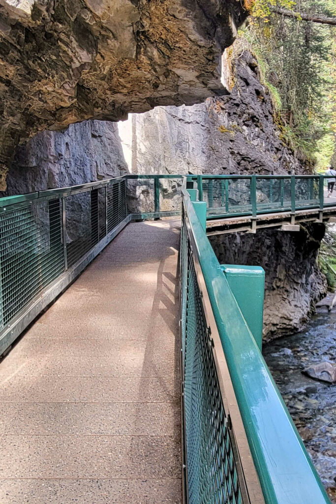 A narrow walkway in Johnston Canyon in Banff - the crowds really thing out in fall