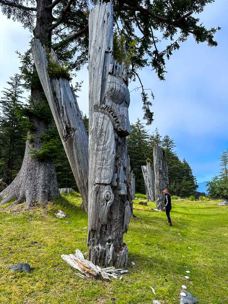 A carved memorial pole at SGang Gwaay in Gwaii Haanas National Park one of the best places to experience Indigenous tourism in Canada