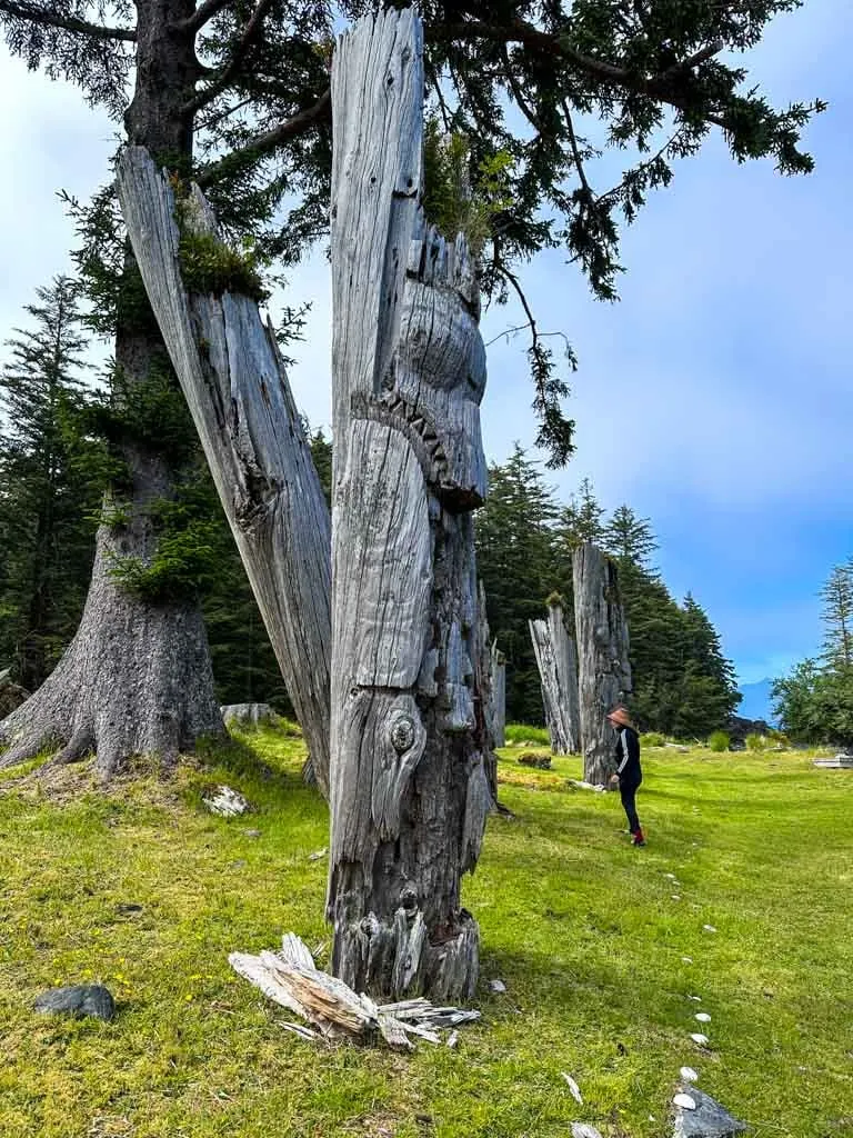 A carved memorial pole at SGang Gwaay