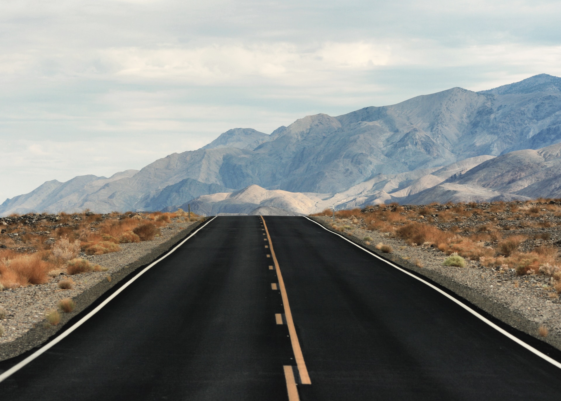 A straight and empty road into Death Valley National Park