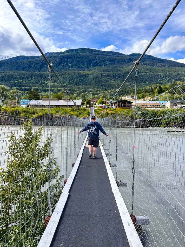Crossing the suspension bridge at Gitwinksilhkw