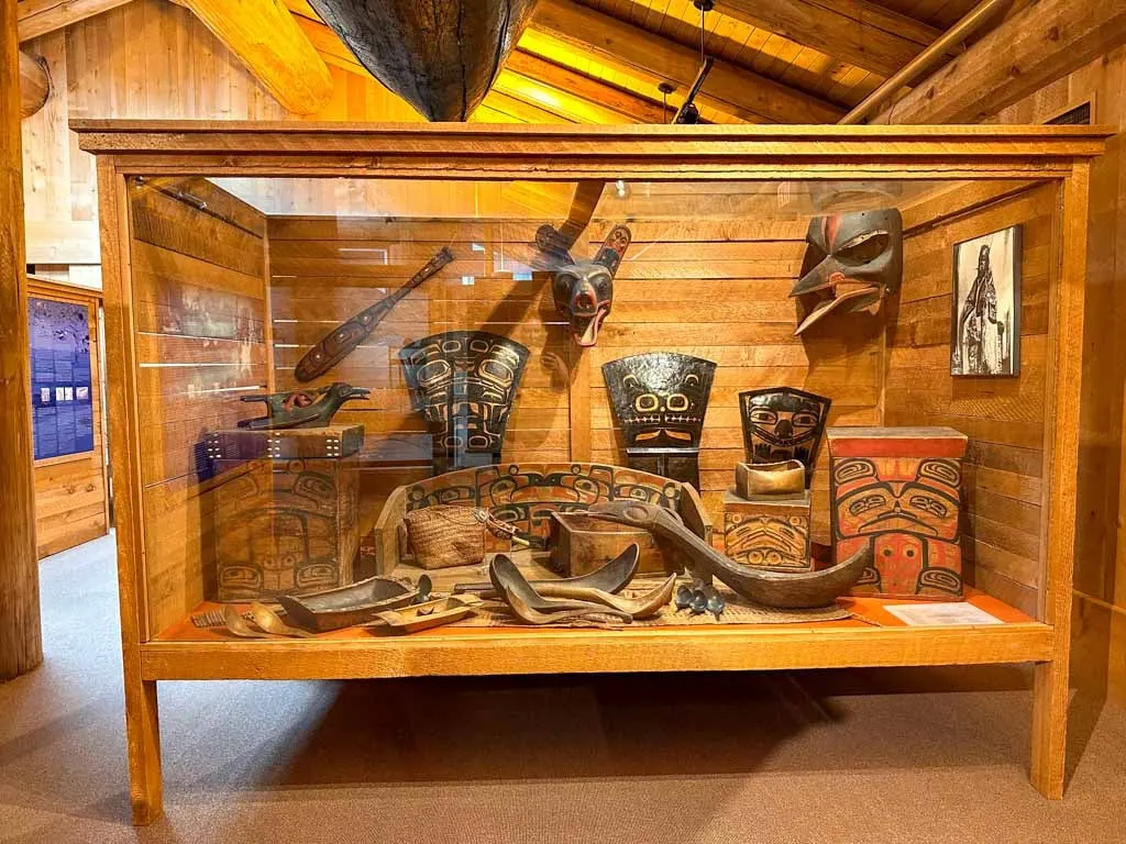 A display case full of Indigenous art and cultural objects at the Museum of Northern BC
