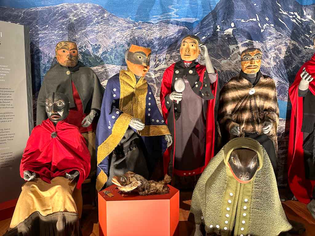 Mannequins wear traditional masks and robes at the Nisga'a Museum