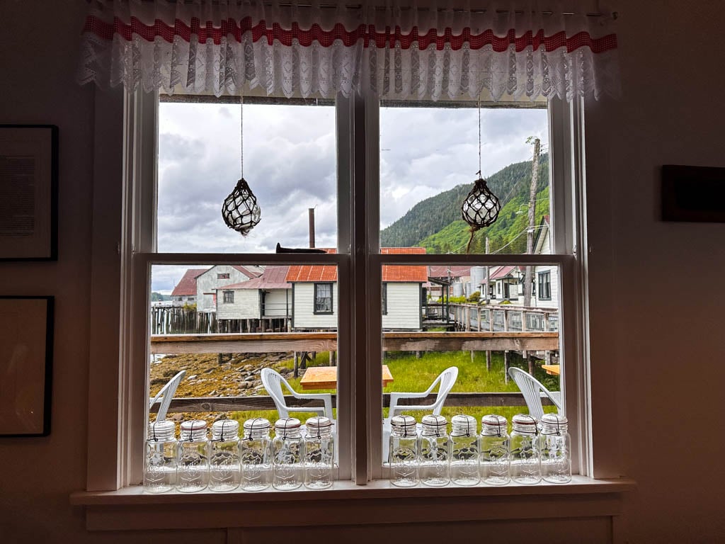 Looking through the window of a historical building at the North Pacific Cannery