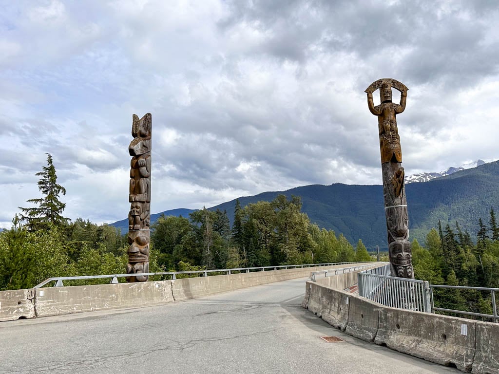 Totem poles on the bridge to Gitwinksilhkw