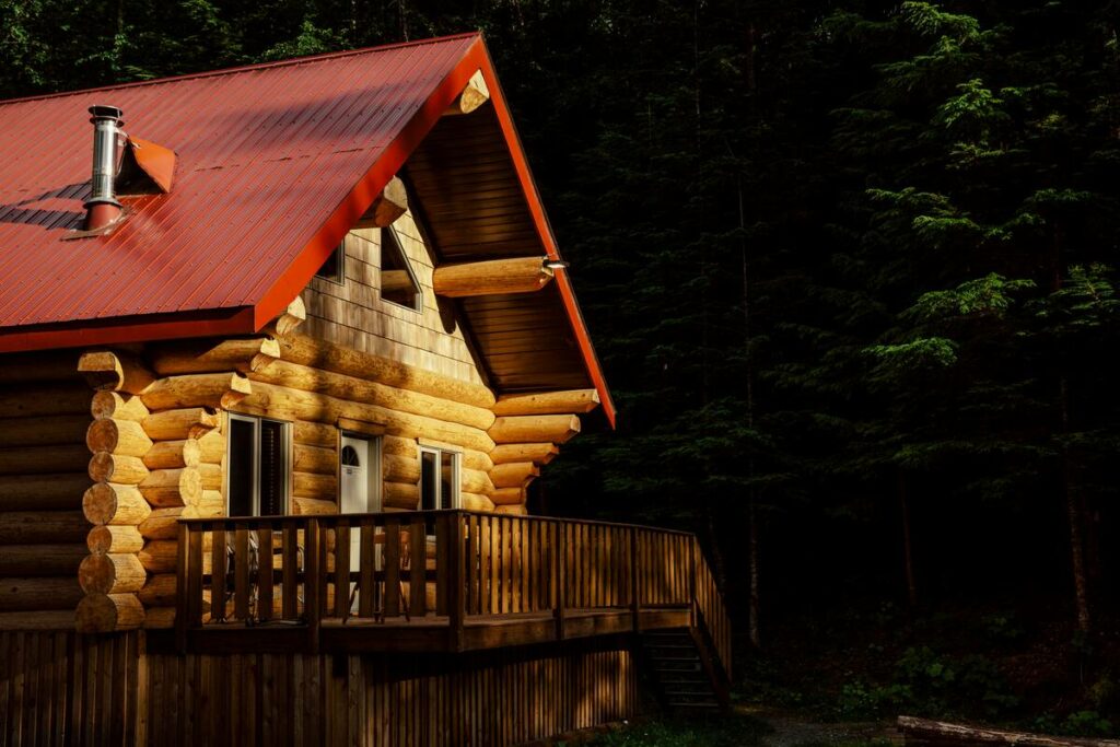 The log cabin exterior of the Vetter Falls Lodge in the Nass Valley