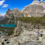 Two hikers on the All Soul's Route on Lake O'Hara Alpine Circuit in Yoho National Park
