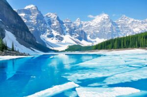 Moraine Lake with melting ice - one of the best things to do in Banff in spring.