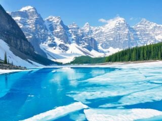 Moraine Lake with melting ice - one of the best things to do in Banff in spring.
