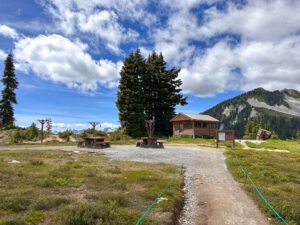 Cooking shelter, picnic tables, and food hanging pole at the Elfin Lakes Campground