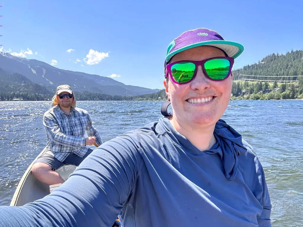 A couple takes a selfie in a canoe in Whistler