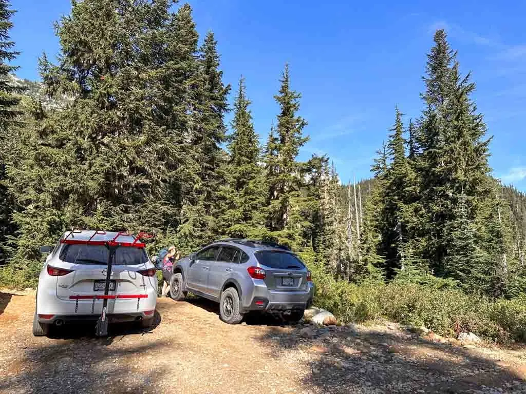 Two cars parked at the start of the Semaphore Lakes hike on the Hurley Forest Service Road