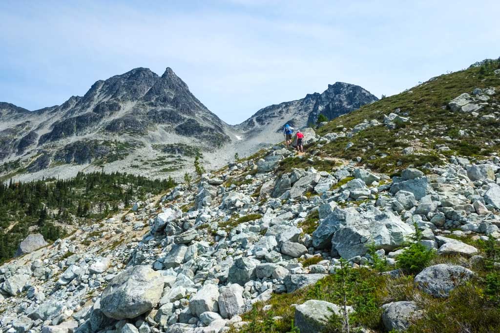 Hikers on a rocky trail on Blackcomb Peak in Whistler