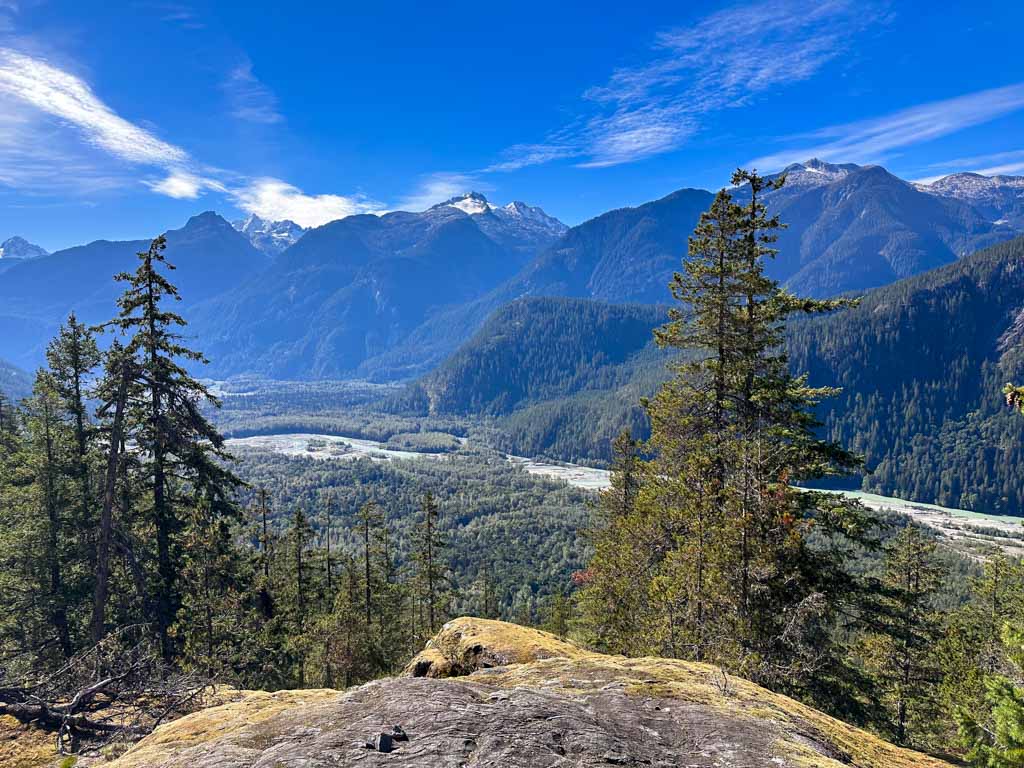 View of the Squamish River Valley and the Tantalus Mountains from a rock bluff above the valley. 