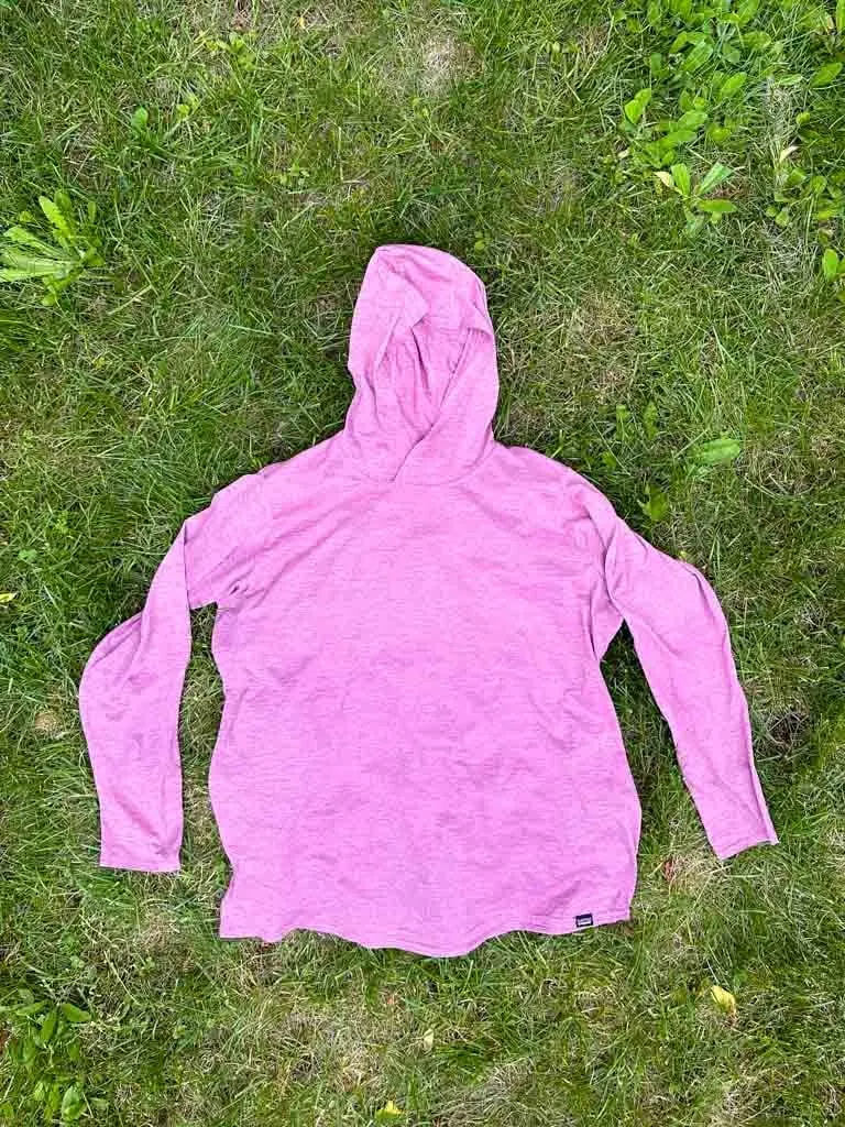 Patagonia Capilene Cool Daily Hoody laying flat on grass