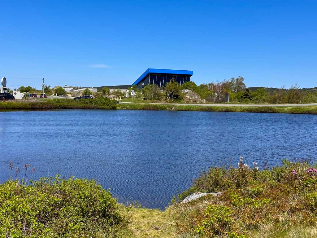 The exterior of the Johnson Geo Centre seen from across a pond.