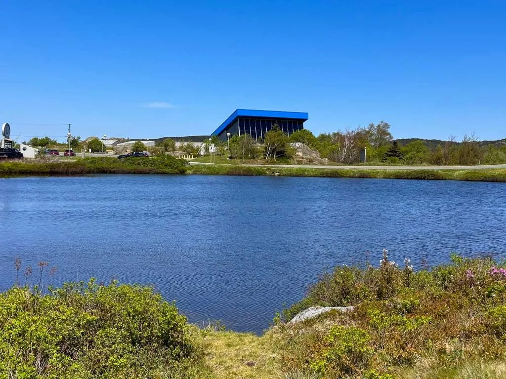 The exterior of the Johnson Geo Centre seen from across a pond.