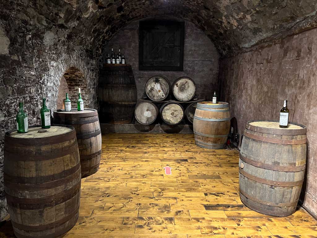 Barrels of port in the underground Newman Wine Vaults 