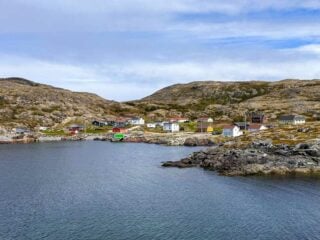 A group of fishermen's shacks along the coast on Fogo Island, Newfoundland - there are so many things to do on Fogo Island