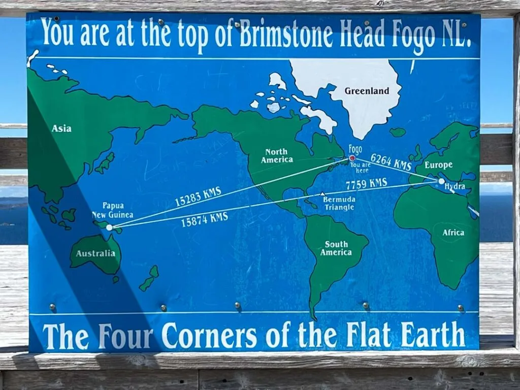 Sign marking one of the four corners of the flat earth at the top of Brimstone Head on Fogo Island. 