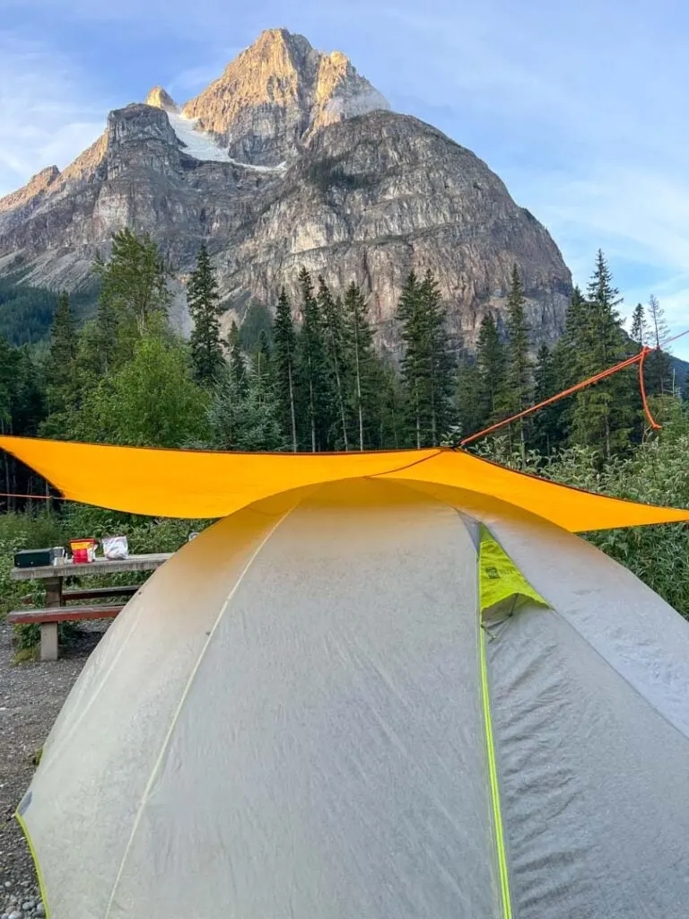 Tent under a tarp at Kicking Horse Campground in Yoho National Park. 