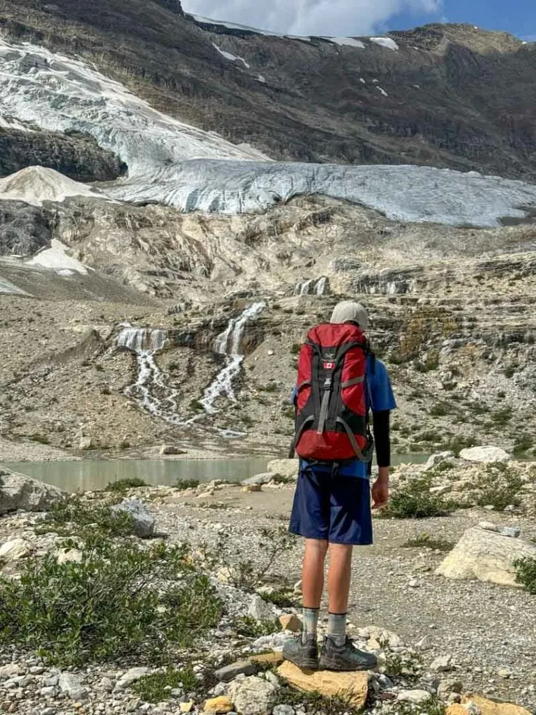 A hiker enjoys the view on the Iceline Trail